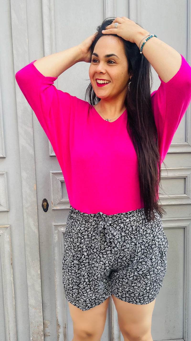 Short fluide, avec poches. Noir