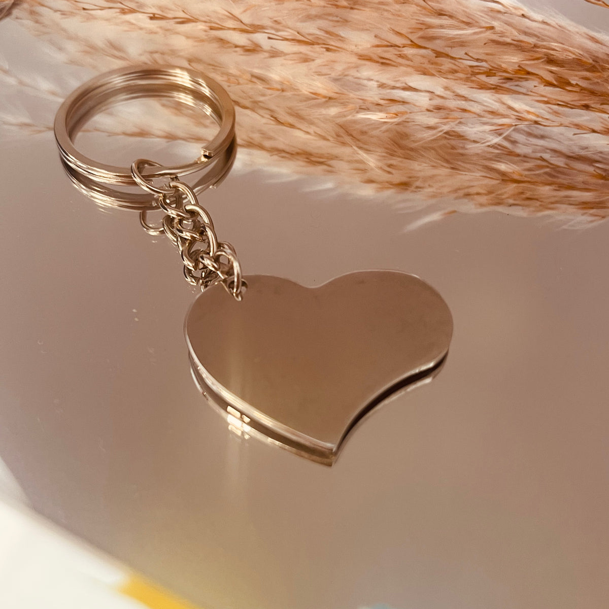 Porte clé coeur acier . Personnalisable